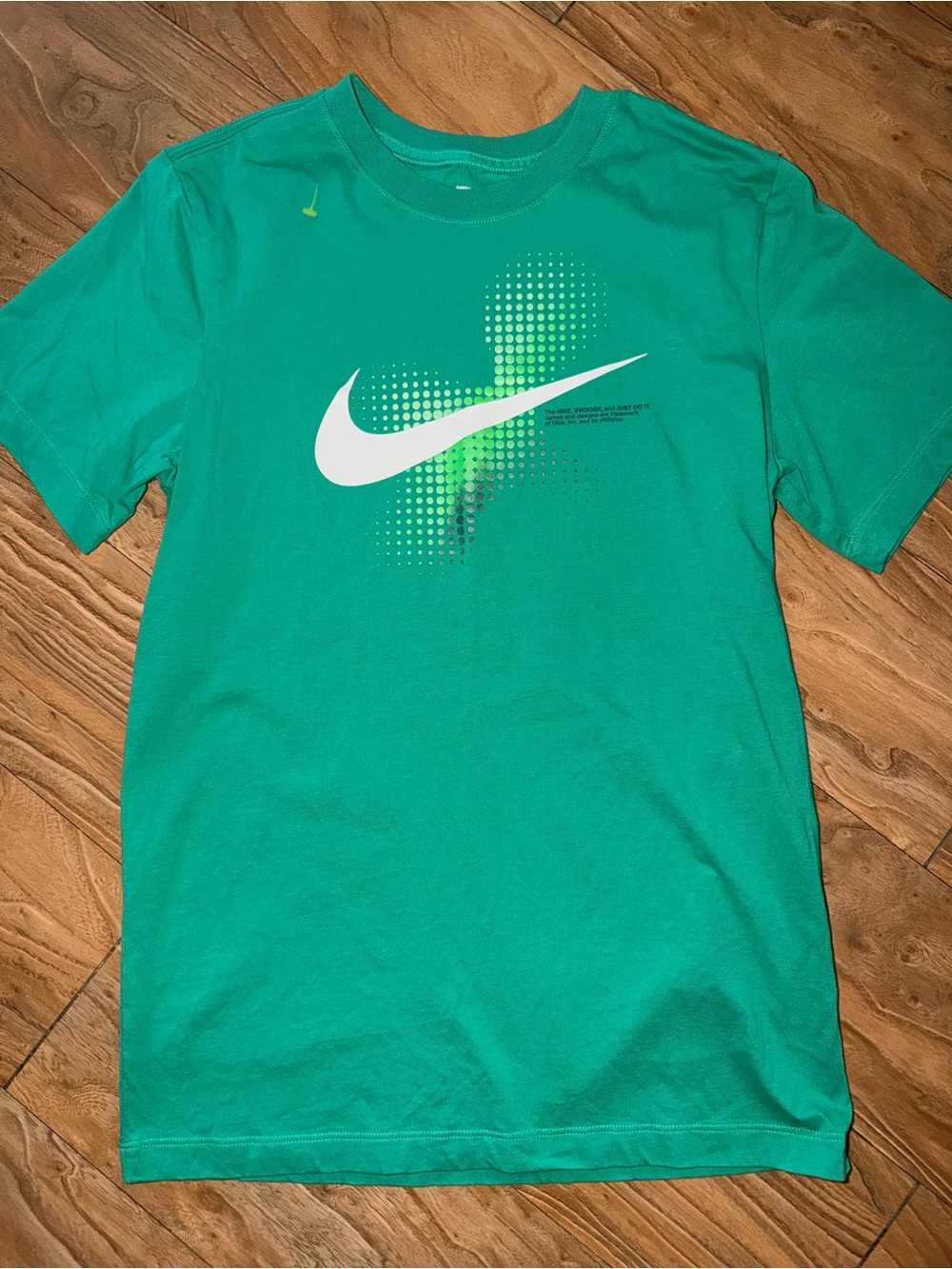 Nike Men's Green Short Sleeve Graphic Tee with White Swoosh